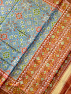 SkyBlue Navratna Design Tissue Double Zari Patola Saree